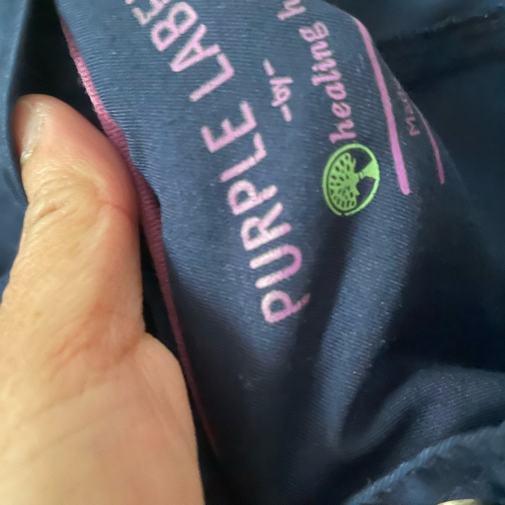 Pair of navy blue purple label scrubs. Used but in good condition.